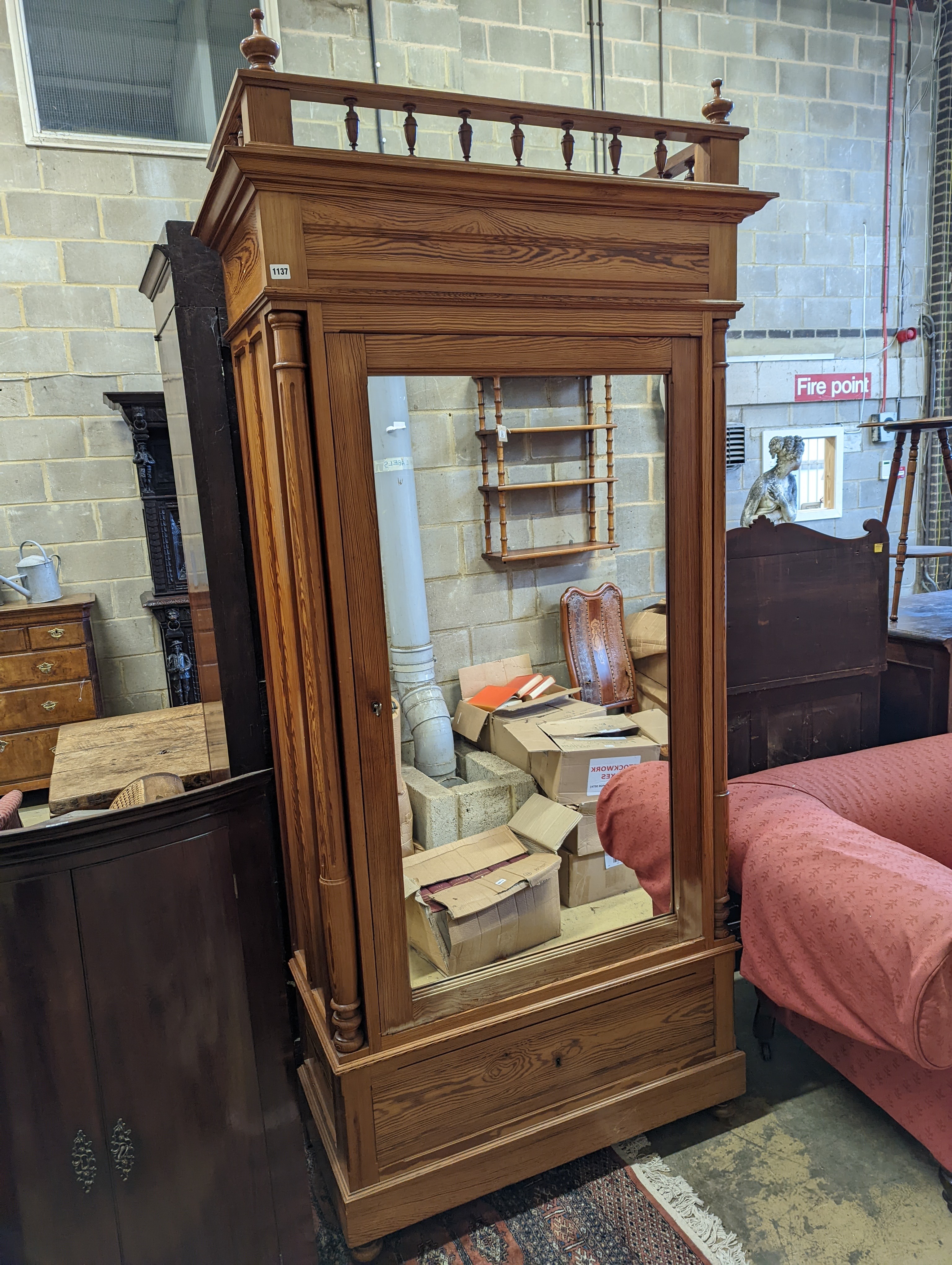 A 19th century French pitch pine mirrored armoire, width 107cm, depth 48cm, height 232cm